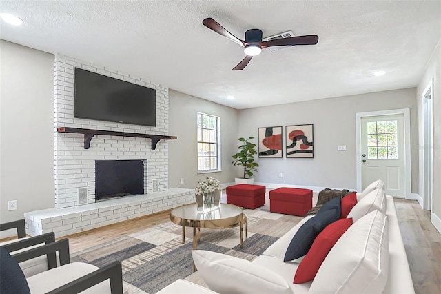 236 N Ranger Blvd, Winter Park, FL 32792 - living room with wood finished floors, ceiling fan, a brick fireplace, recessed lighting, and a textured ceiling