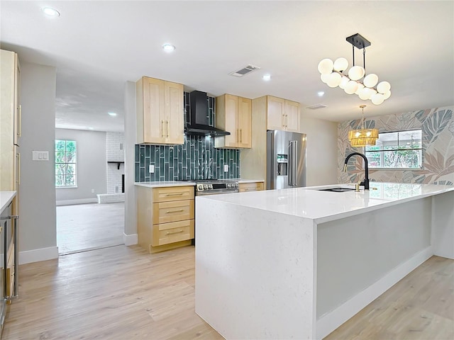 236 N Ranger Blvd, Winter Park, FL 32792 - kitchen with appliances with stainless steel finishes, light brown cabinets, tasteful backsplash, light wood-style floors, and light countertops