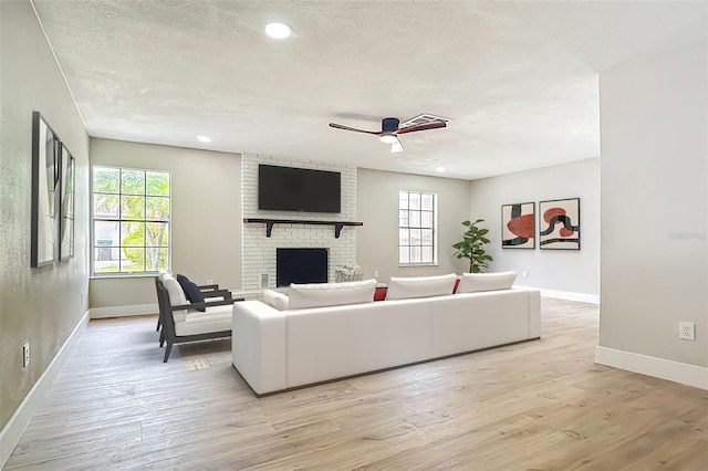 236 N Ranger Blvd, Winter Park, FL 32792 - living area with a ceiling fan, healthy amount of natural light, light wood-style floors, a textured ceiling, and recessed lighting