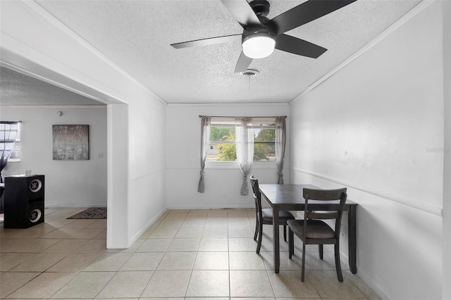 dining area featuring crown molding and a textured ceiling
