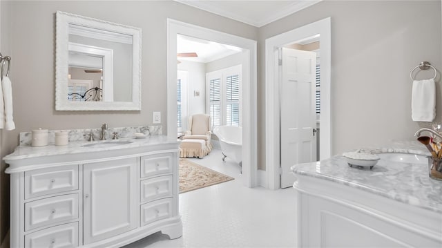 full bathroom with ornamental molding, a soaking tub, and vanity