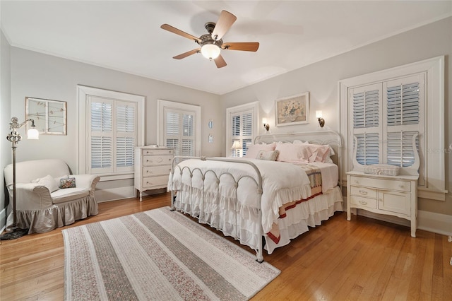 bedroom with wood finished floors and ceiling fan