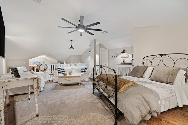 bedroom featuring ceiling fan, lofted ceiling, and visible vents