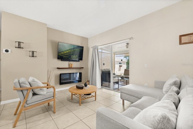 living room featuring light tile patterned floors and baseboards