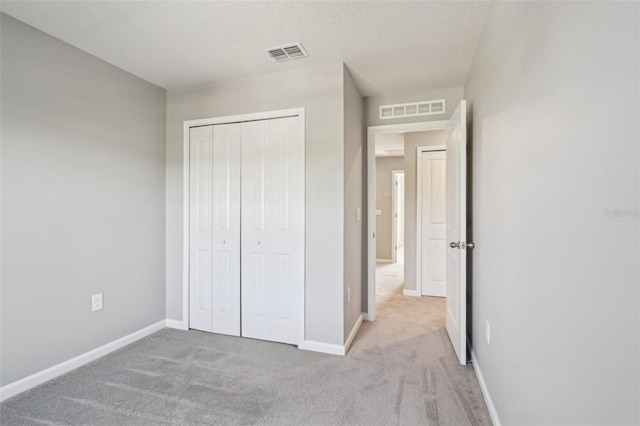 6013 Blue Lily Way, Winter Garden, FL 34787 - unfurnished bedroom with carpet and a closet