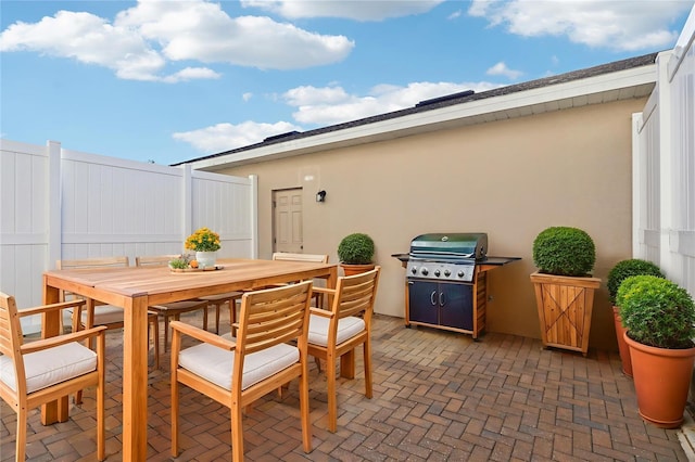 6013 Blue Lily Way, Winter Garden, FL 34787 - view of patio / terrace with outdoor dining area and a grill