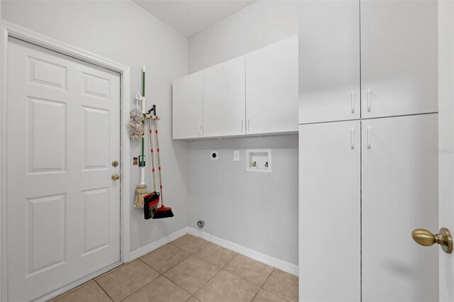 1868 Rachels Ridge Loop Unit L, Ocoee, FL 34761 - laundry room with electric dryer hookup, cabinet space, washer hookup, and light tile patterned floors