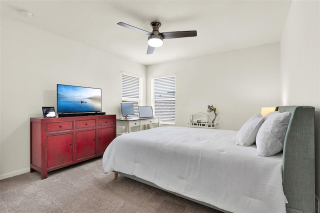 bedroom featuring a ceiling fan, baseboards, and carpet floors