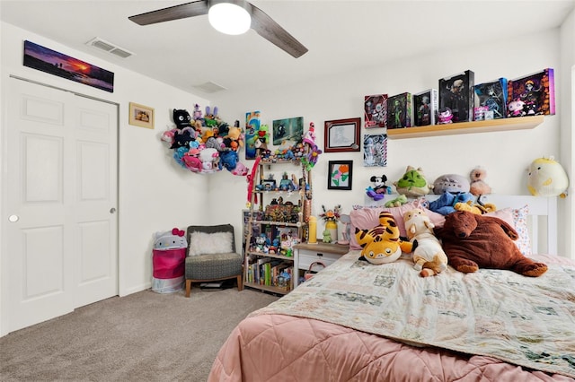 carpeted bedroom featuring visible vents and ceiling fan