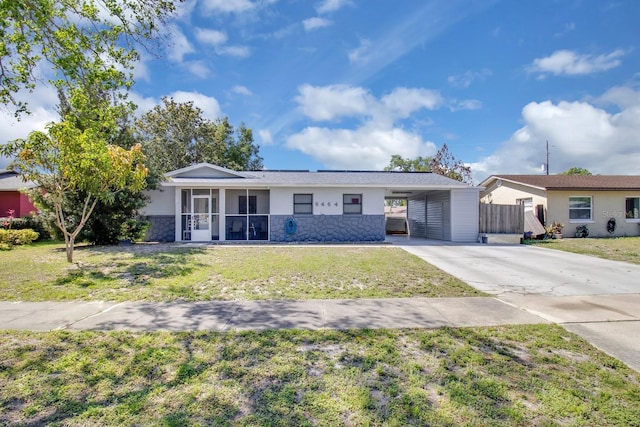 6464 Inca St, Orlando, FL 32807 - single story home with concrete driveway, stucco siding, a carport, and stone siding