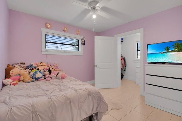 6464 Inca St, Orlando, FL 32807 - bedroom featuring multiple windows, light tile patterned floors, ceiling fan, and baseboards