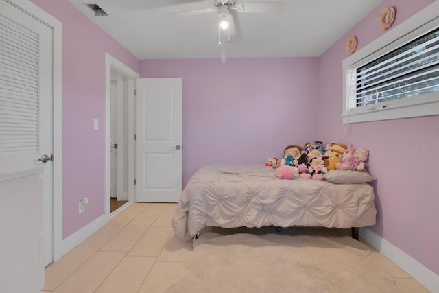 6464 Inca St, Orlando, FL 32807 - bedroom with baseboards, ceiling fan, and light tile patterned floors