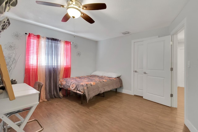 6464 Inca St, Orlando, FL 32807 - bedroom with light wood-type flooring and ceiling fan