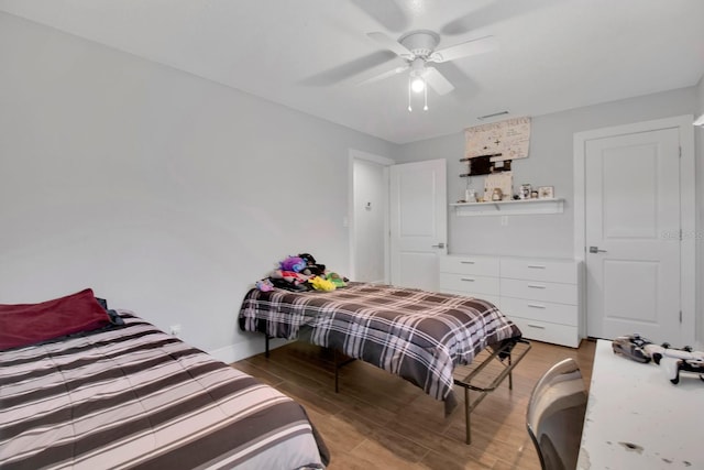 6464 Inca St, Orlando, FL 32807 - bedroom with light wood-style floors, ceiling fan, and baseboards