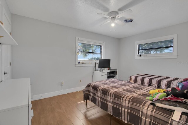 6464 Inca St, Orlando, FL 32807 - bedroom featuring light wood-style floors, baseboards, and ceiling fan