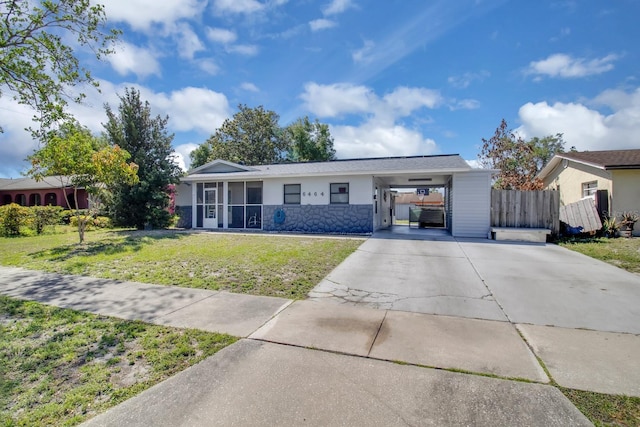 6464 Inca St, Orlando, FL 32807 - ranch-style home with concrete driveway and an attached carport