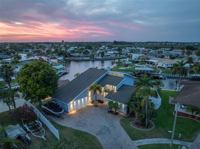aerial view of residential area featuring a nearby body of water