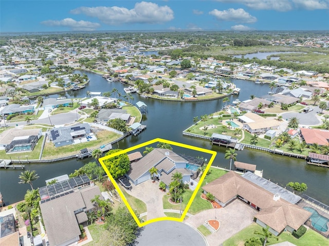 aerial view of residential area featuring property boundaries highlighted and a large body of water