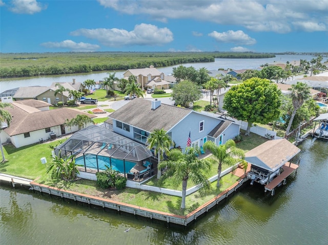 aerial view of residential area featuring a nearby body of water