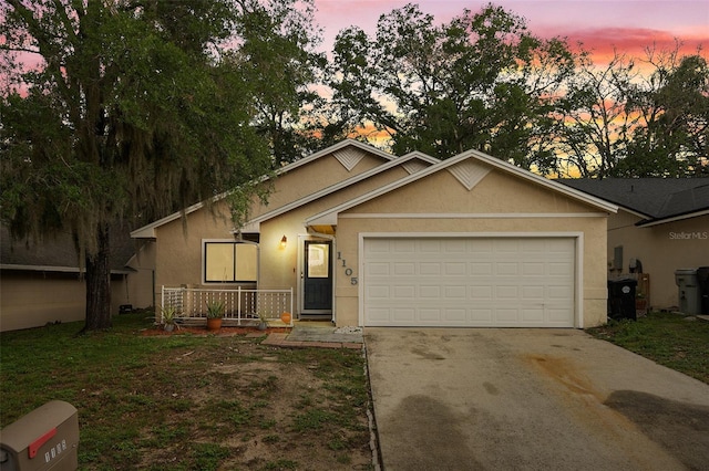 1105 Mill Run Cir, Apopka, FL 32703 - single story home with stucco siding, concrete driveway, and an attached garage
