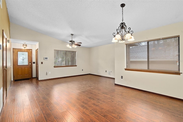 1105 Mill Run Cir, Apopka, FL 32703 - unfurnished living room featuring a chandelier, lofted ceiling, ceiling fan, wood finished floors, and baseboards