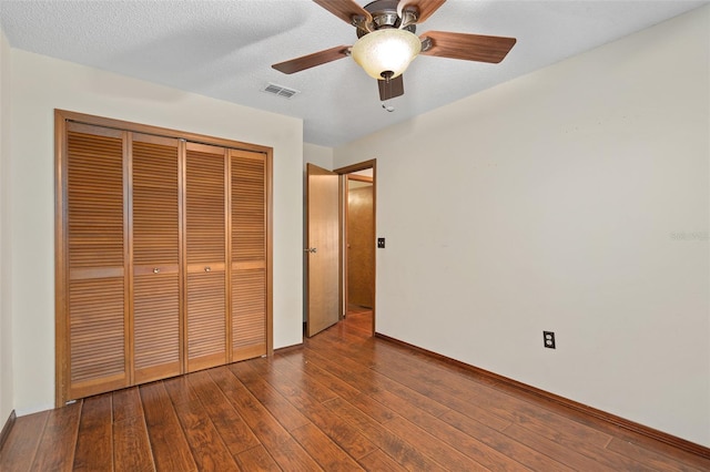 1105 Mill Run Cir, Apopka, FL 32703 - unfurnished bedroom with a closet, hardwood / wood-style flooring, baseboards, and ceiling fan