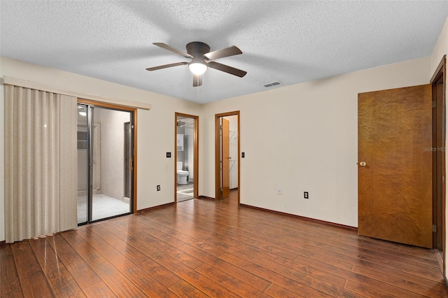 1105 Mill Run Cir, Apopka, FL 32703 - unfurnished bedroom featuring wood finished floors, baseboards, a textured ceiling, ceiling fan, and connected bathroom
