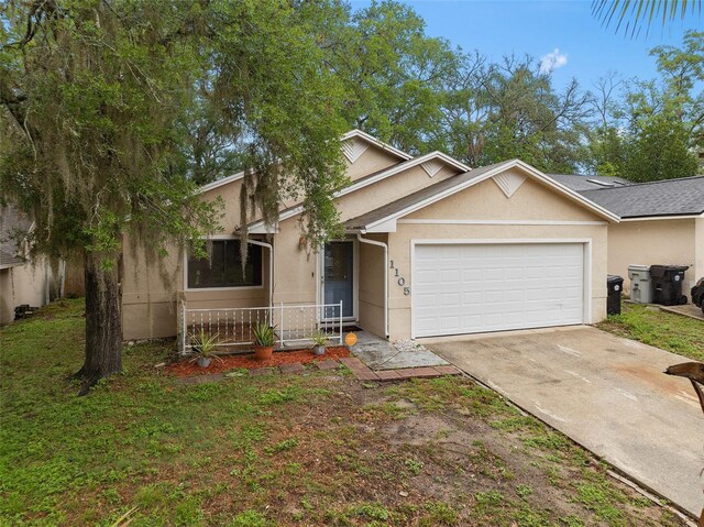 1105 Mill Run Cir, Apopka, FL 32703 - view of front of house featuring an attached garage, stucco siding, concrete driveway, and a front lawn