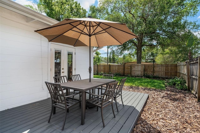 1424 W New Hampshire St, Orlando, FL 32804 - wooden deck with french doors, outdoor dining space, and a fenced backyard