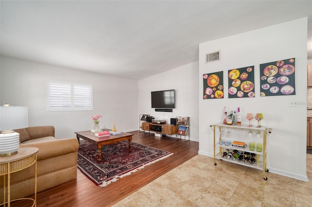 1424 W New Hampshire St, Orlando, FL 32804 - living room featuring baseboards, lofted ceiling, and visible vents