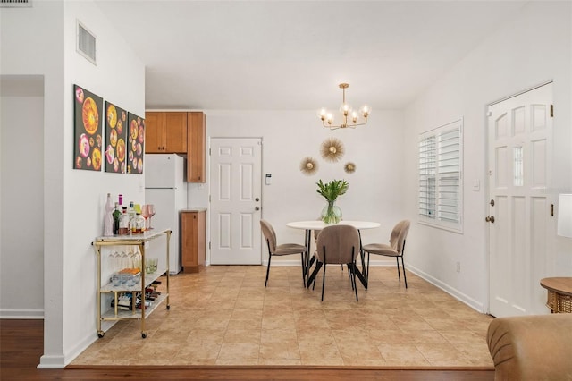 1424 W New Hampshire St, Orlando, FL 32804 - dining room with visible vents, baseboards, and a chandelier
