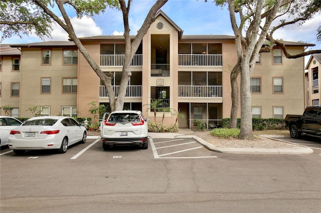 956 Salt Pond Pl Unit 207, Altamonte Springs, FL 32714 - view of apartment building / complex featuring uncovered parking