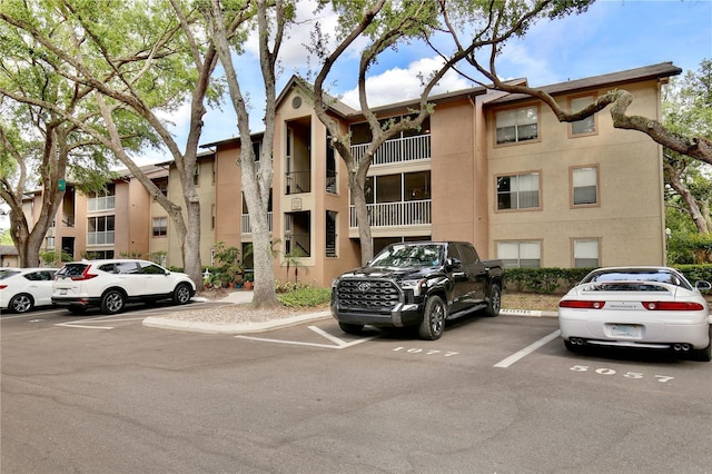 956 Salt Pond Pl Unit 207, Altamonte Springs, FL 32714 - view of building exterior featuring uncovered parking