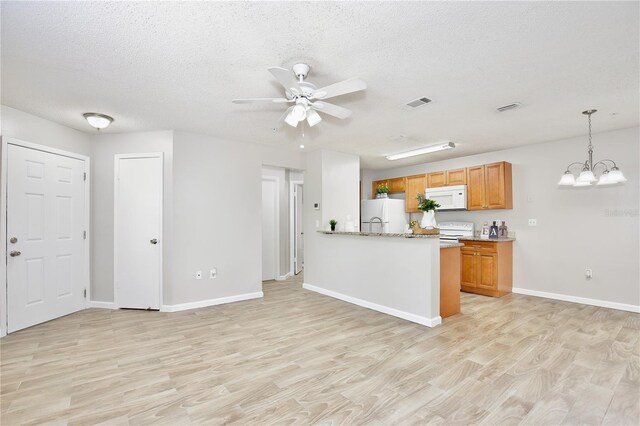 956 Salt Pond Pl Unit 207, Altamonte Springs, FL 32714 - kitchen featuring white appliances, light wood-style floors, ceiling fan, brown cabinetry, and baseboards