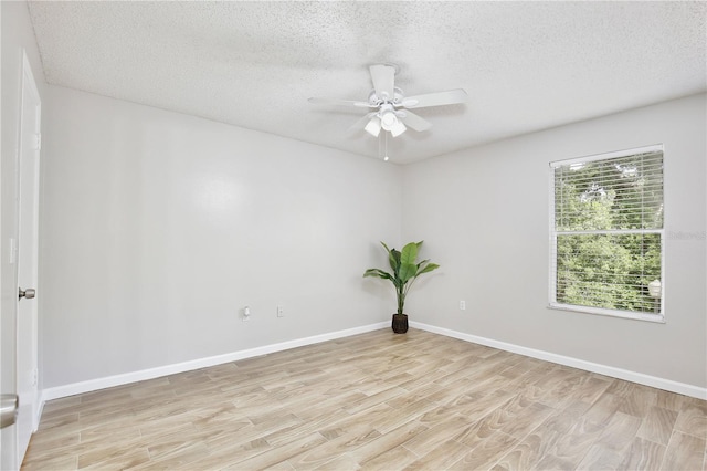 956 Salt Pond Pl Unit 207, Altamonte Springs, FL 32714 - spare room featuring light wood finished floors, ceiling fan, a textured ceiling, and baseboards
