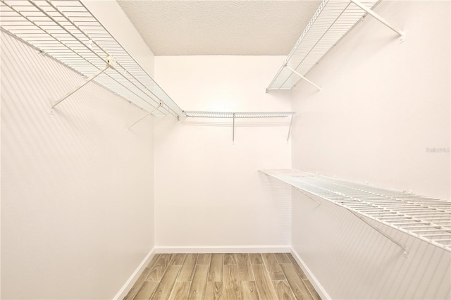 956 Salt Pond Pl Unit 207, Altamonte Springs, FL 32714 - spacious closet featuring wood finished floors