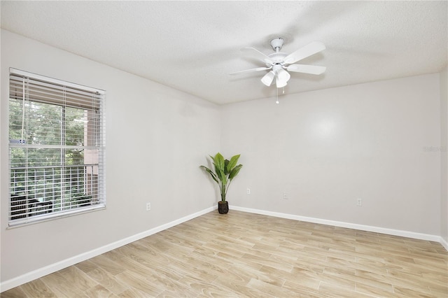 956 Salt Pond Pl Unit 207, Altamonte Springs, FL 32714 - empty room with a ceiling fan, light wood-style floors, baseboards, and a textured ceiling