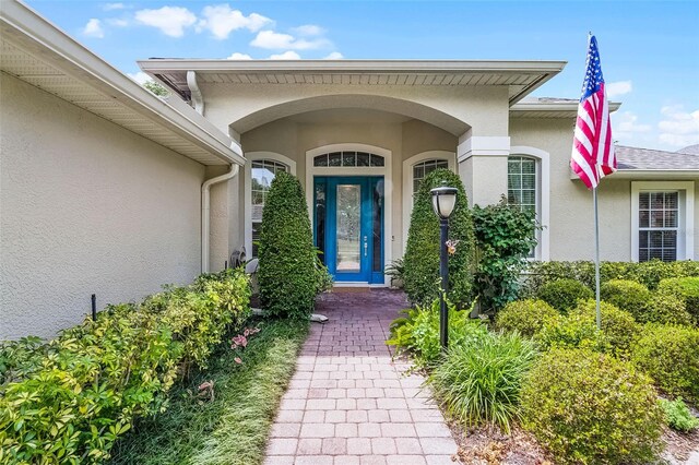 doorway to property with stucco siding
