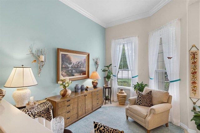 living area with carpet flooring and crown molding