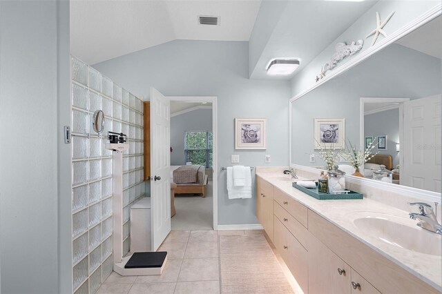 bathroom featuring connected bathroom, a sink, and visible vents