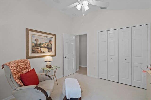 sitting room featuring baseboards, carpet flooring, high vaulted ceiling, and ceiling fan