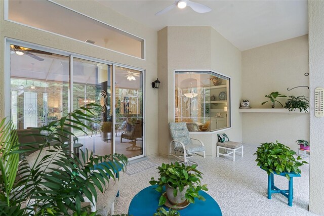 doorway to property featuring stucco siding, visible vents, and ceiling fan