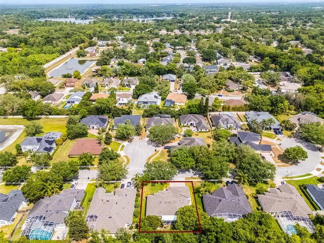 aerial view with a water view and a residential view
