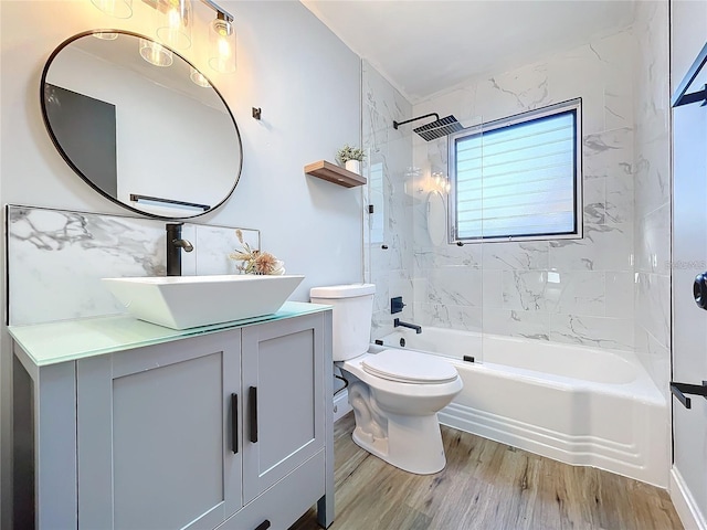 905 W 11th Ave, Mount Dora, FL 32757 - bathroom with wood finished floors, vanity, shower / washtub combination, and toilet