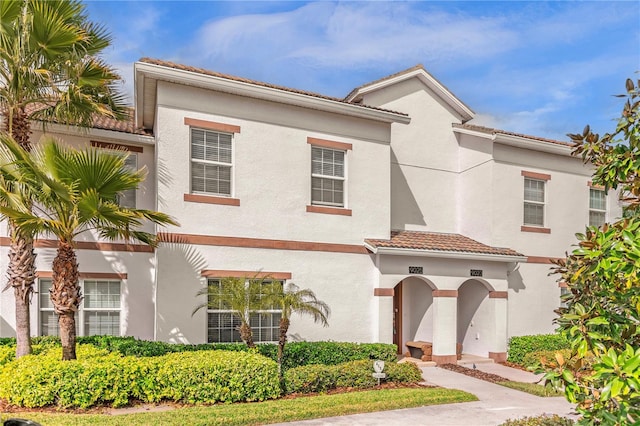 9025 Dogleg Dr, Davenport, FL 33896 - view of front facade with a tiled roof and stucco siding