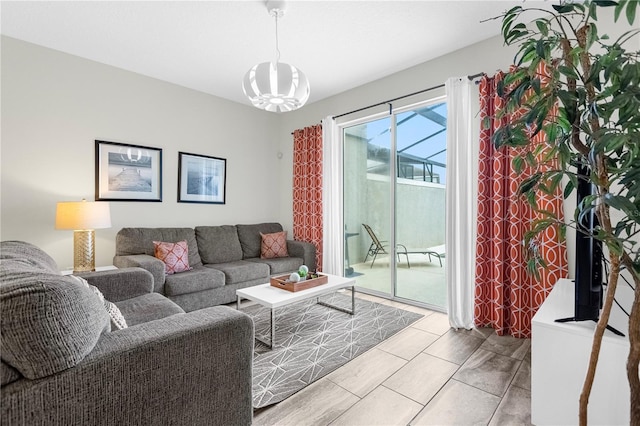 9025 Dogleg Dr, Davenport, FL 33896 - living room featuring a notable chandelier