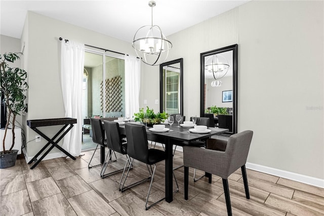 9025 Dogleg Dr, Davenport, FL 33896 - dining space with baseboards and a chandelier