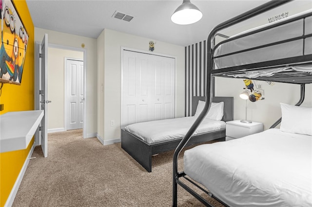 9025 Dogleg Dr, Davenport, FL 33896 - bedroom featuring baseboards, visible vents, a closet, and light colored carpet