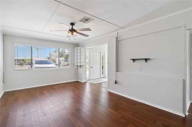 unfurnished living room with wood finished floors, a ceiling fan, visible vents, and baseboards