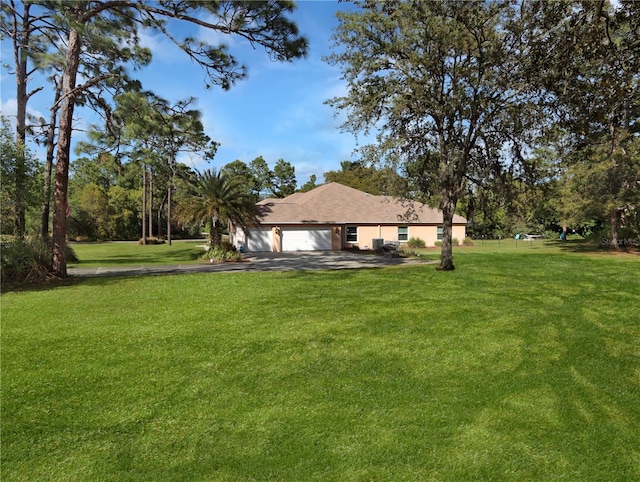 4675 Ficus Dr, Beverly Hills, FL 34465 - view of yard featuring driveway and a garage